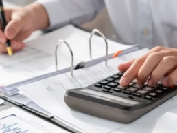 corporate auditor calculating budget with calculator his office desk dedicated accountant professional accounting business company analyzing financial document forecast income insight