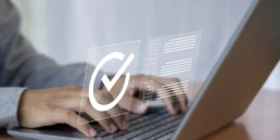 online checklist completion hands laptop with verification symbol